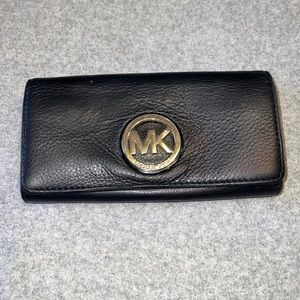 Michael kors wallet black with mk gold logo.